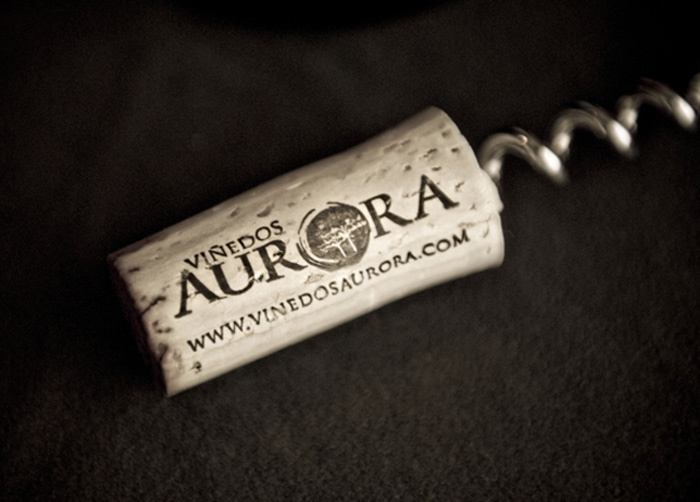 Viñedos Aurora logo on wine bottle cork. Logo designed by Julie Mendez.